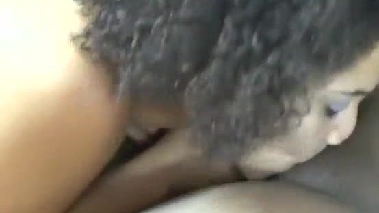 Ebony with curly hair toying pussy