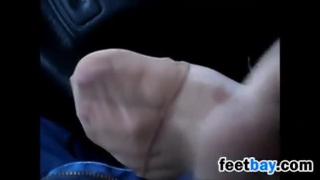 Brunette smelly feet in car