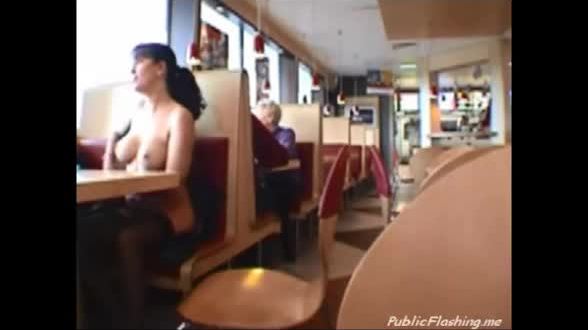 Cutie flashing natural tits in restaurant
